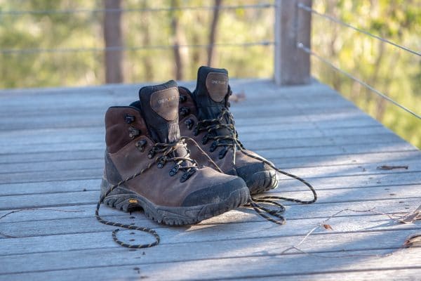 pair of columbia hiking boots on a wood deck