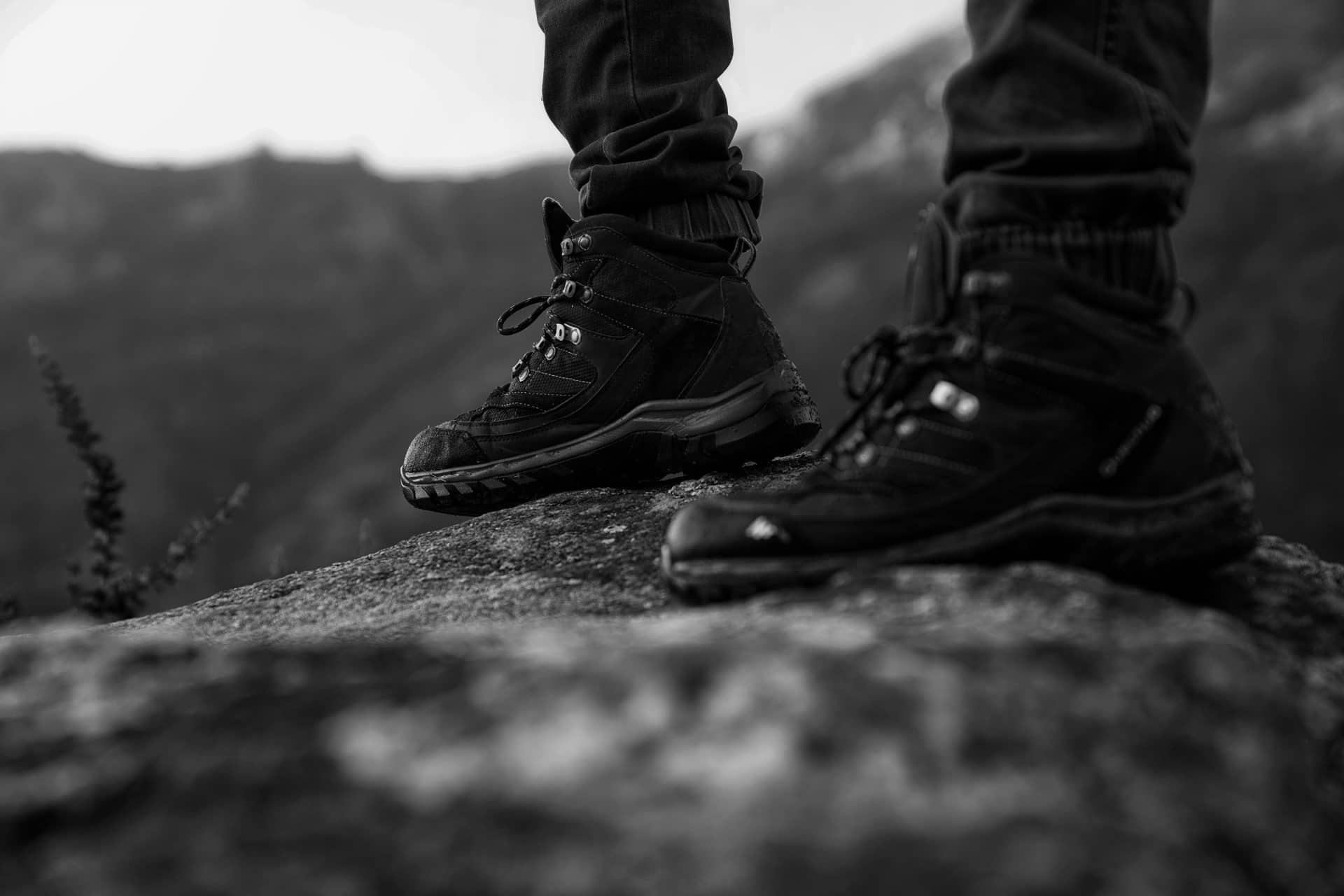 person standing on a hill