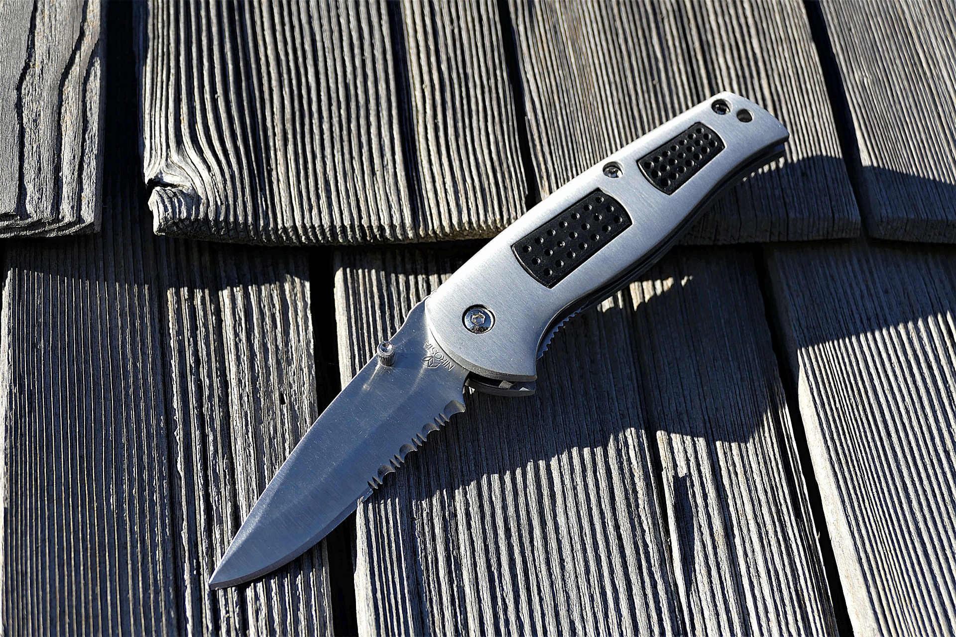 Old Timer pocket knife placed at the wooden floor