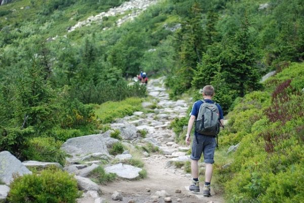 man hiking rocky trail