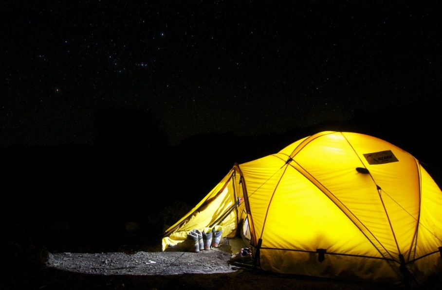 ez up tent: yellow tent under starry nigh