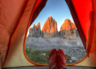 pitching a tent: camping environment feet grass