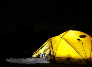 ez up tent: yellow tent under starry nigh