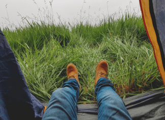 photo of man in blue jeans and work boots